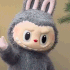 labubu waving Slack emoji