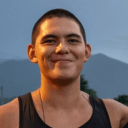 smiling guy backpack mountain Slack emoji