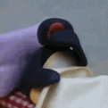 pingu on bed yawning Slack emoji