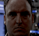 serious man shadowed face Slack emoji
